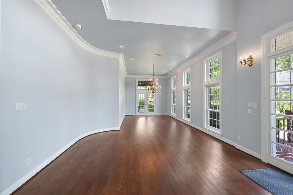 Secondary bedroom with rich hardwood floors