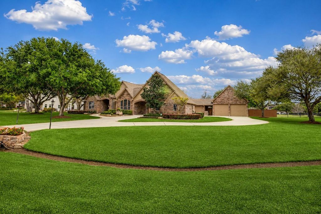 Front — Sweeping Driveway & Garages