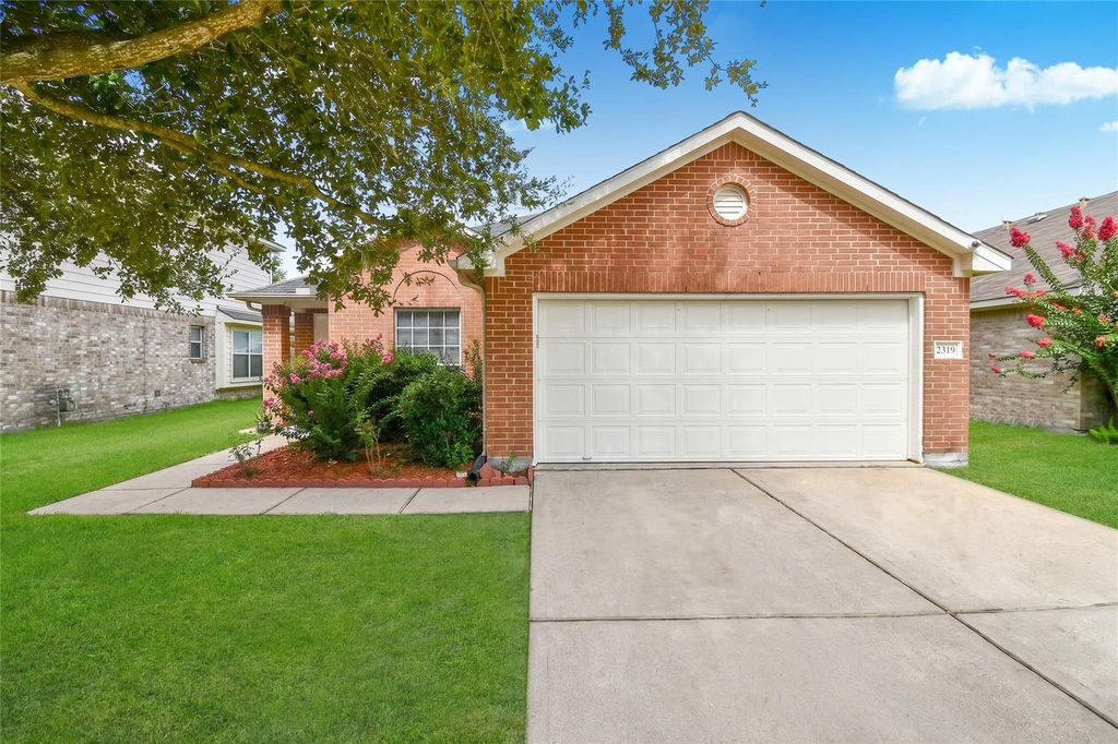 Front exterior with mature shade tree